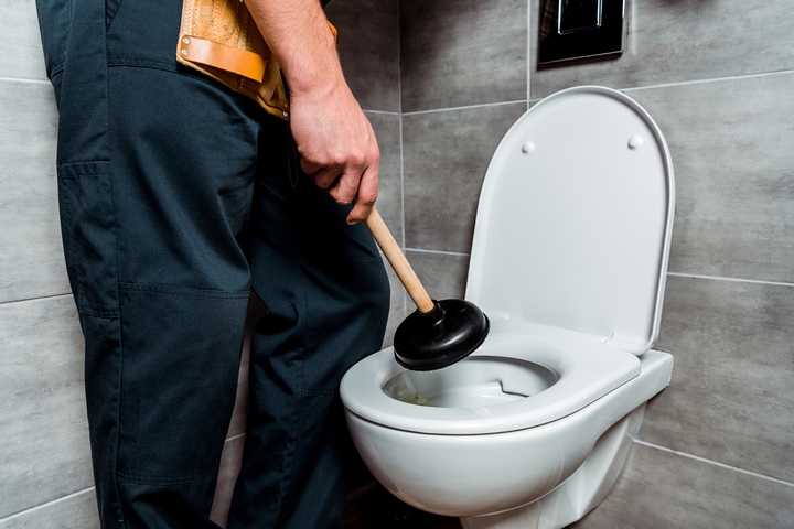 Unblock the toilet with a plunger